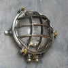 A reclaimed nautical circular solid cast aluminium bulkhead with brass fittings