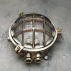 A reclaimed nautical circular solid cast aluminium bulkhead with brass fittings