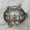 A reclaimed nautical circular solid cast aluminium bulkhead with brass fittings