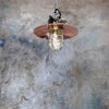 A reclaimed industrial copper and brass cage pendant light. This is an original explosion proof ceiling light