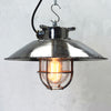 Vintage industrial cage ceiling light made from cast steel with LED filament light bulb. professionally refurbished by British lighting restoration specialists Loomlight.