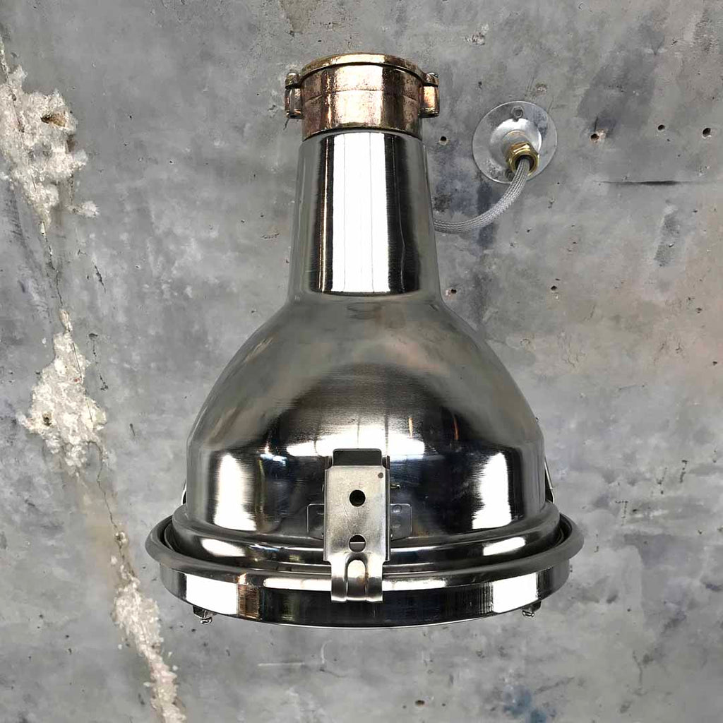Industrial Chrome wall light fixtures. Directional lighting that can be used as a wall washer 
