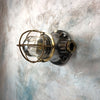 A small vintage industrial mild steel bulkhead wall light.
