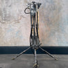 steampunk style aluminium floor lamp with tripod legs and Edison filament LED light bulbs in flameproof glass tubes