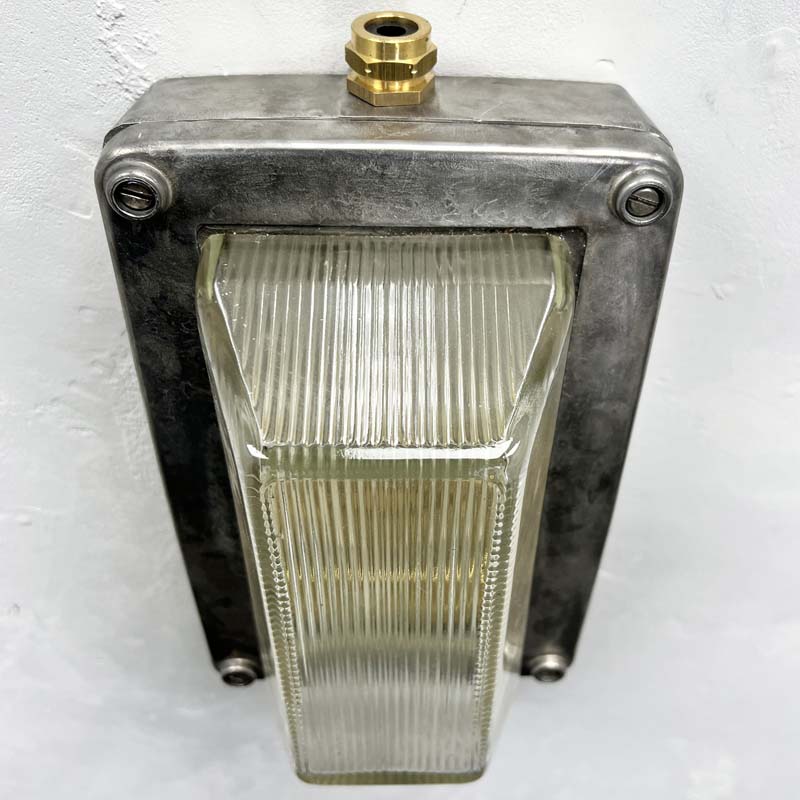 An industrial aluminium bulkhead wall light by General Electric Company made c1995. Reclaimed and restored by hand in UK by Loomlight, ready to be installed either vertically or horizontally.