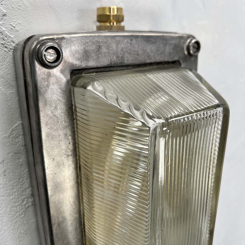 An industrial aluminium bulkhead wall light by General Electric Company made c1995. Reclaimed and restored by hand in UK by Loomlight, ready to be installed either vertically or horizontally.