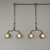 vintage industrial small spot lighting on galvanised conduit