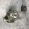 A reclaimed vintage industrial explosion proof outdoor iron wall light with cage, made c1970.