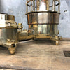 A vintage industrial cast bronze and brass explosion proof table lamp with an isolator switch