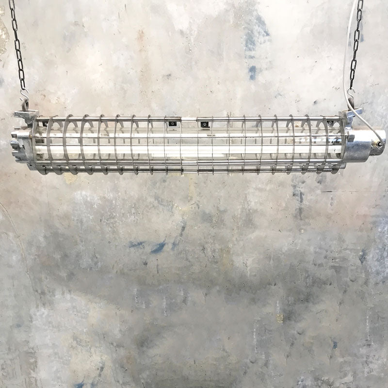 Our aluminium vintage caged strip lights at 4ft long are eye catching hanging strip lights. Vintage industrial style ceiling lighting restored for modern interiors.