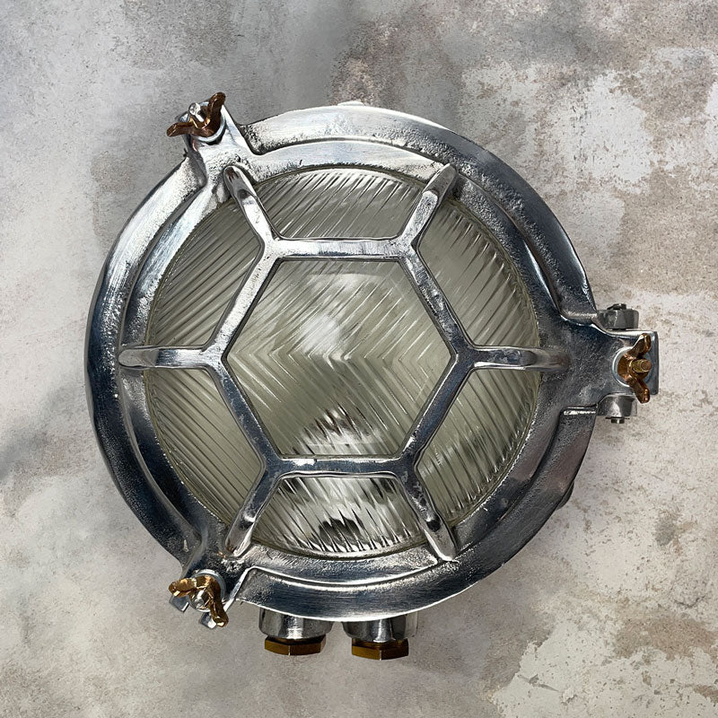 Vintage industrial Cast Aluminium Circular Outdoor Bulkhead Light. With robust prismatic glass and industrial style protective cage. compatible with LED light bulbs