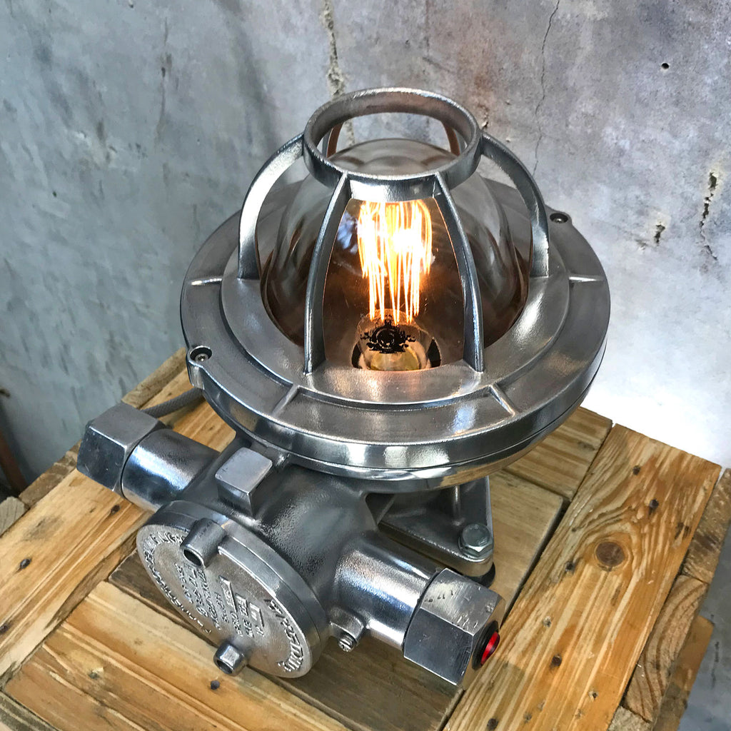 Solid aluminium and tempered glass atex lighting suitable as a desk lamp, table lamp or floor lamp. Highly robust as it was originally an industrial lamp. Loomlight have reclaimed and restored the lamp and it is now ready for modern interiors.