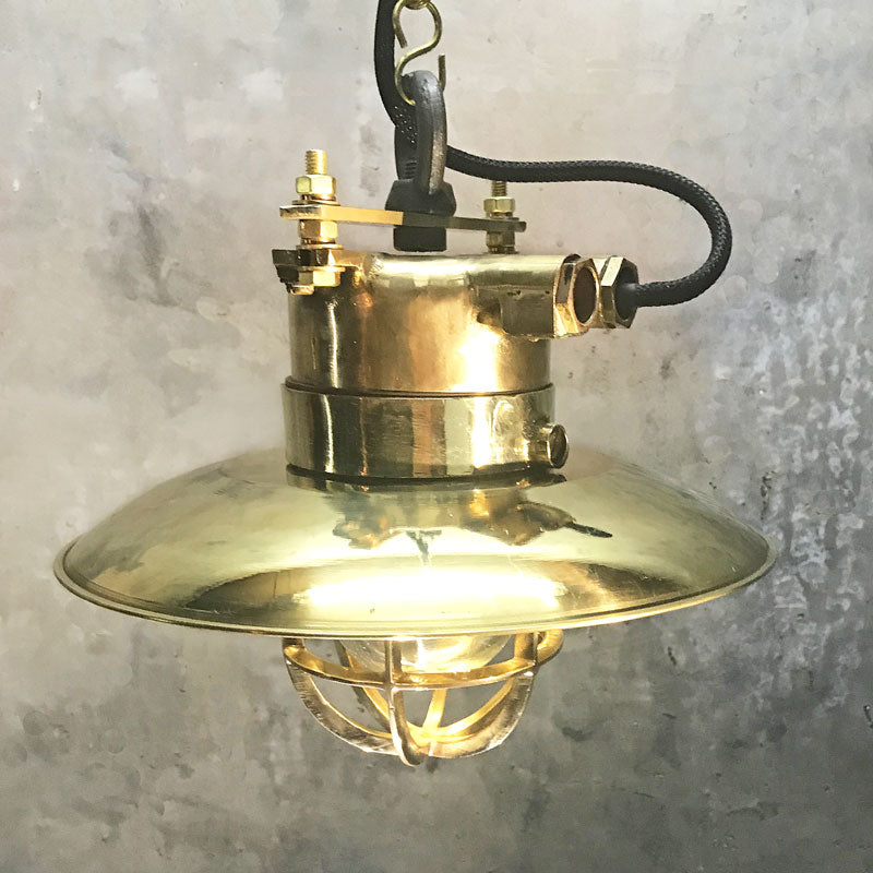 Brass explosion proof cage light for ceiling. A vintage industrial style original ceiling light restored ready to use