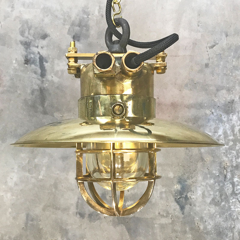 Brass explosion proof cage light for ceiling. A vintage industrial style original ceiling light restored ready to use