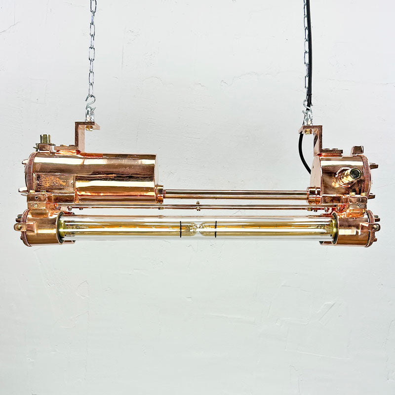 The copper edison strip light is a vintage industrial feature light with a modern finish. It has a highly polished copper finish. Fitted with dimmable LED Edison tubes and supplied with hanging chain and ceiling hooks.