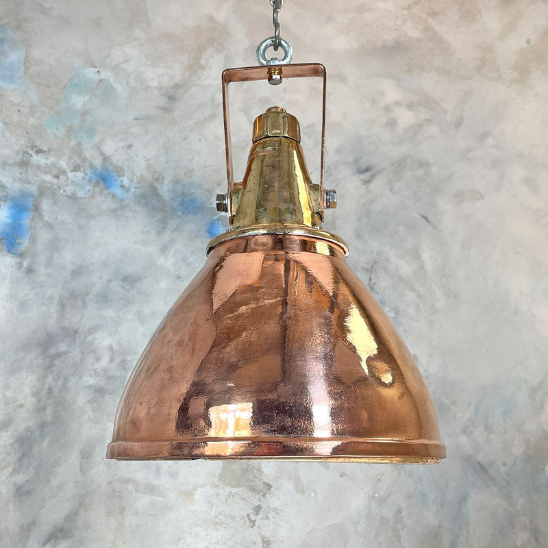A 1970's large industrial copper and brass ceiling pendant light made in Germany. Restored by hand in UK these beautiful original ceiling lights are perfect for creating authentic characterful interiors.