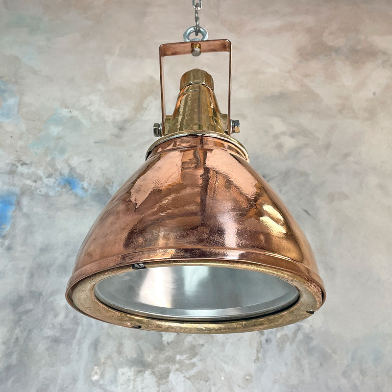A 1970's industrial copper and brass ceiling pendant light made in Germany. Restored by hand in UK these beautiful original ceiling lights are perfect for creating authentic characterful interiors.