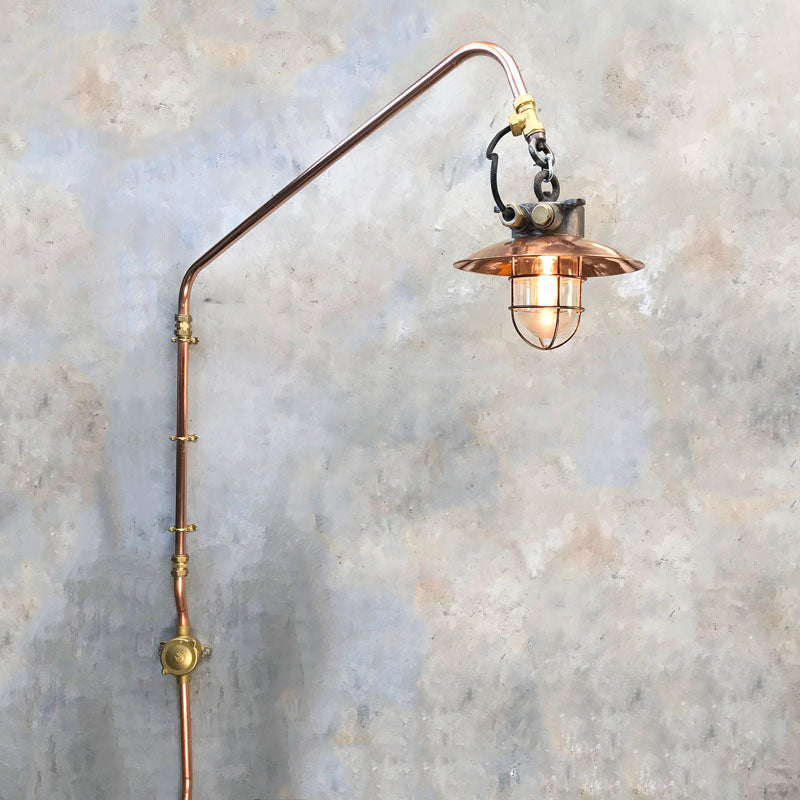 Industrial style swing arm wall light, comprised of copper & iron explosion proof lamp fixed to 22mm copper pipe. 