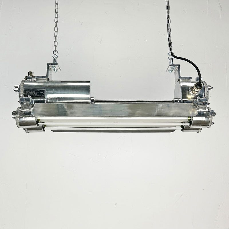 The vintage T8 LED striplight is a reclaimed industrial fixture refurbished for modern interiors. 