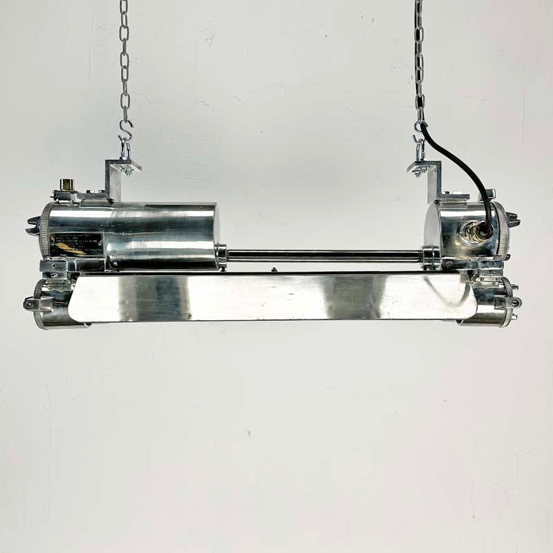 The vintage T8 LED striplight is a reclaimed industrial fixture refurbished for modern interiors. 