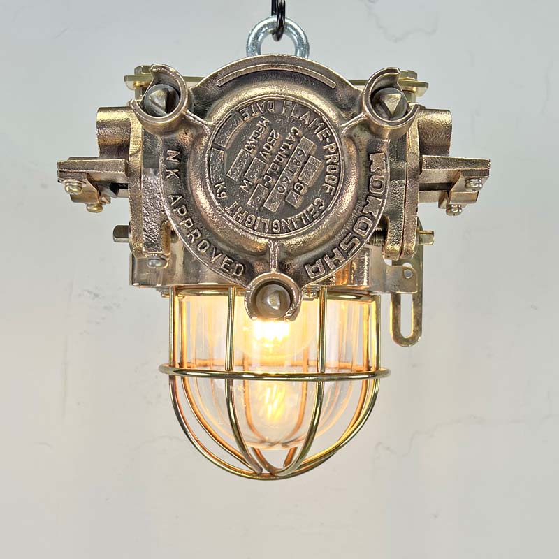 Inject industrial style into your interior with the bronze vintage ceiling light manufactured by Kokosha c1980.  Reclaimed from decommissioned cargo ships.  Professionally restored by hand in UK by Loomlight to modern lighting standards with braided cable and protective cage. 