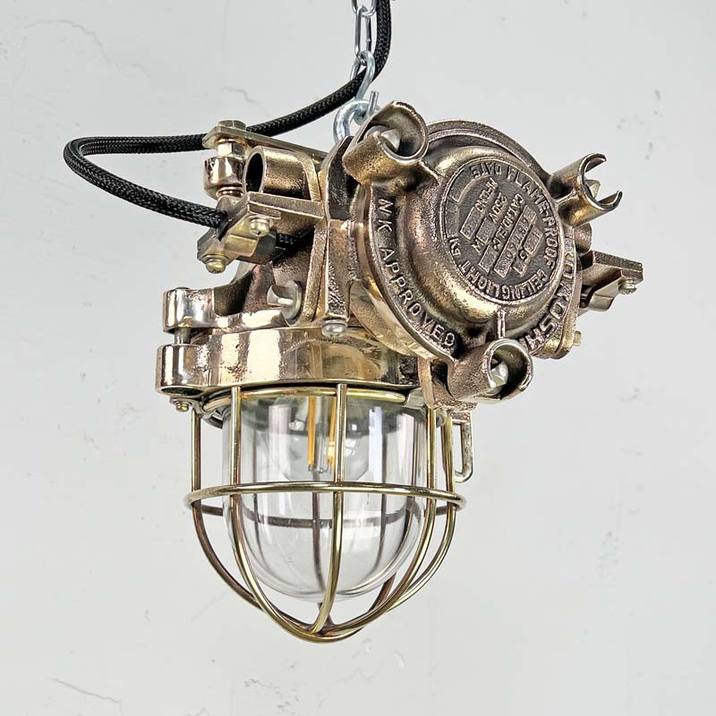 Inject industrial style into your interior with the bronze vintage ceiling light manufactured by Kokosha c1980.  Reclaimed from decommissioned cargo ships.  Professionally restored by hand in UK by Loomlight to modern lighting standards with braided cable and protective cage. 