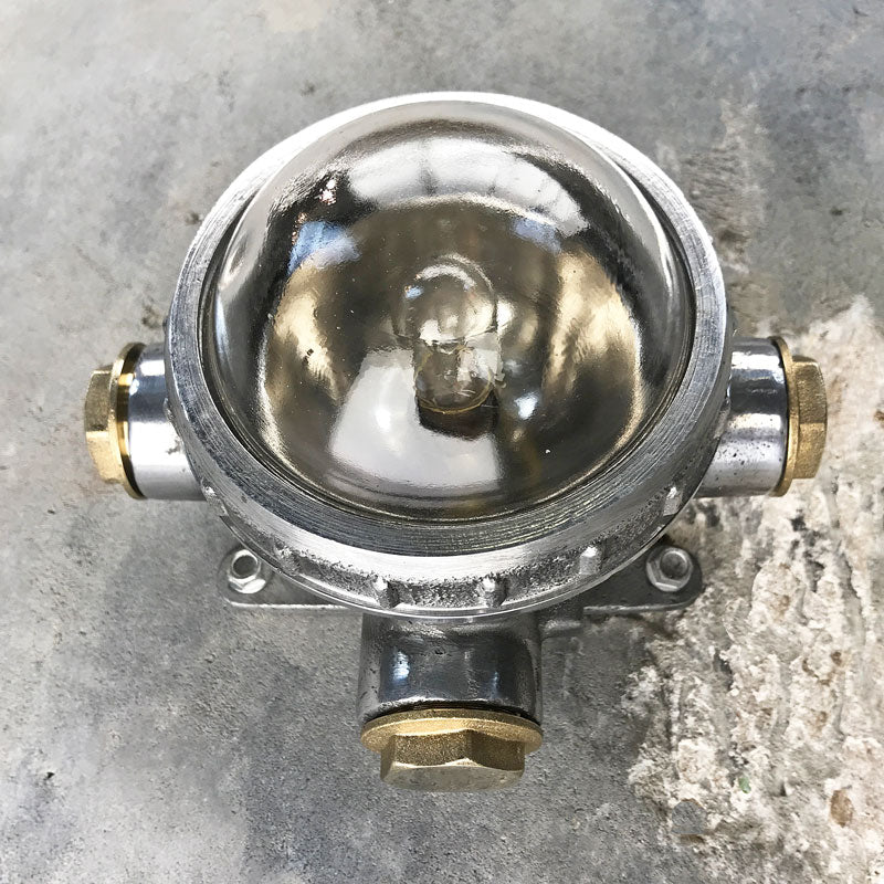 vintage cast aluminium industrial spot light for indoors or outdoor use. Industrial style circular wall light fixture for small spaces. Reclaimed, restored and ready to repurpose.