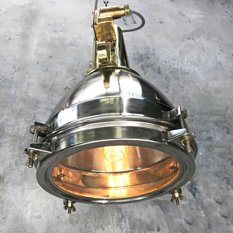 Large Stainless Steel Pendant Light with a brass top section. It has been reclaimed from decommissioned cargo ships. Loomlight professionally restore these fixtures and rewire with E27 lamp holders compatible with LED light bulbs.