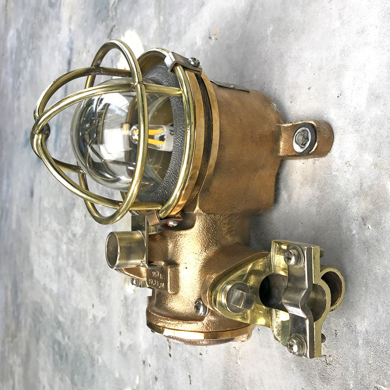 Vintage industrial small cage light in bronze by Kokosha. Restored for indoor use for ultimate industrial style.  