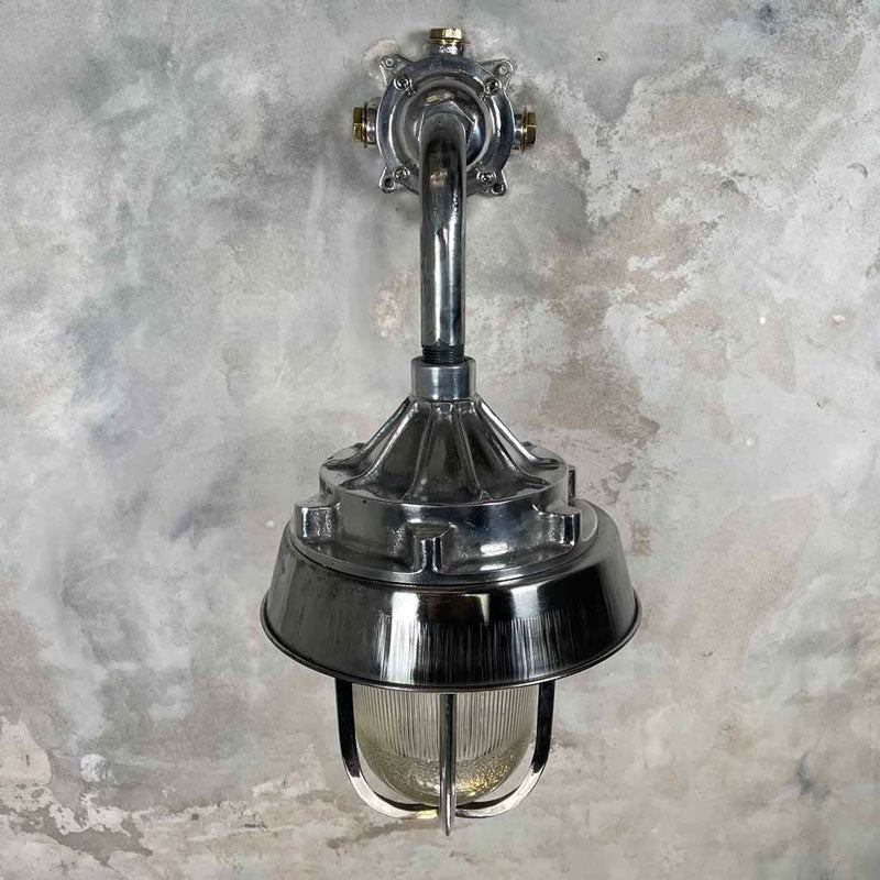 A large outdoor wall light in aluminium and a prismatic glass dome. Perfect for a grand entrance or front door. This vintage outdoor lighting has been restored for modern use