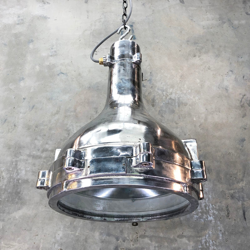 Large industrial ceiling lighting reclaimed from engine rooms. Professionally restored aluminium ceiling light suitable for modern interiors.