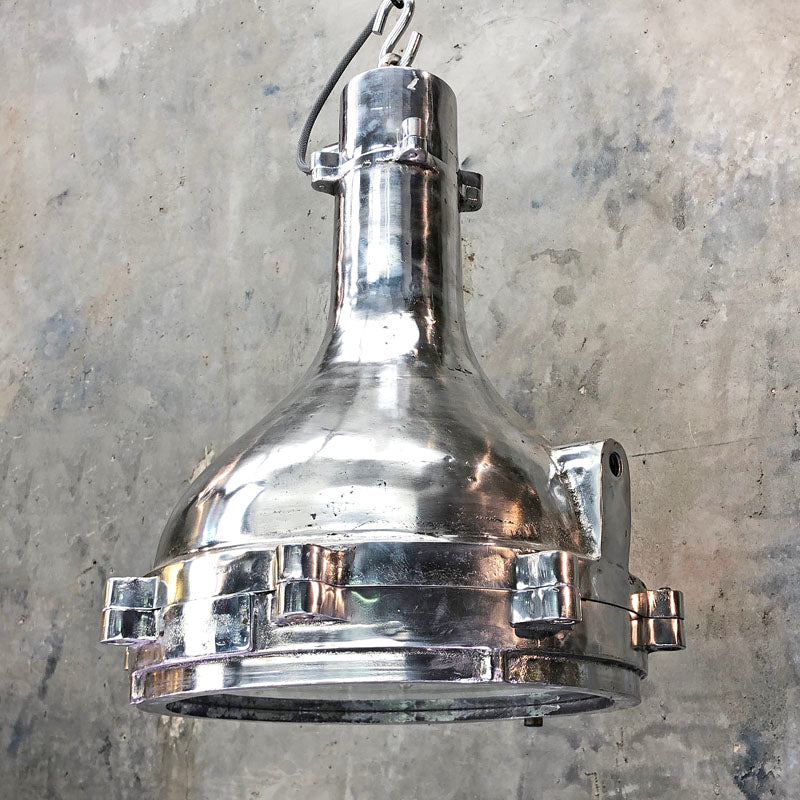 Large industrial ceiling lighting reclaimed from engine rooms. Professionally restored aluminium ceiling light suitable for modern interiors.