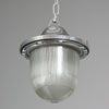 Vintage industrial Aluminium pendant light with prismatic glass shade on a gray background