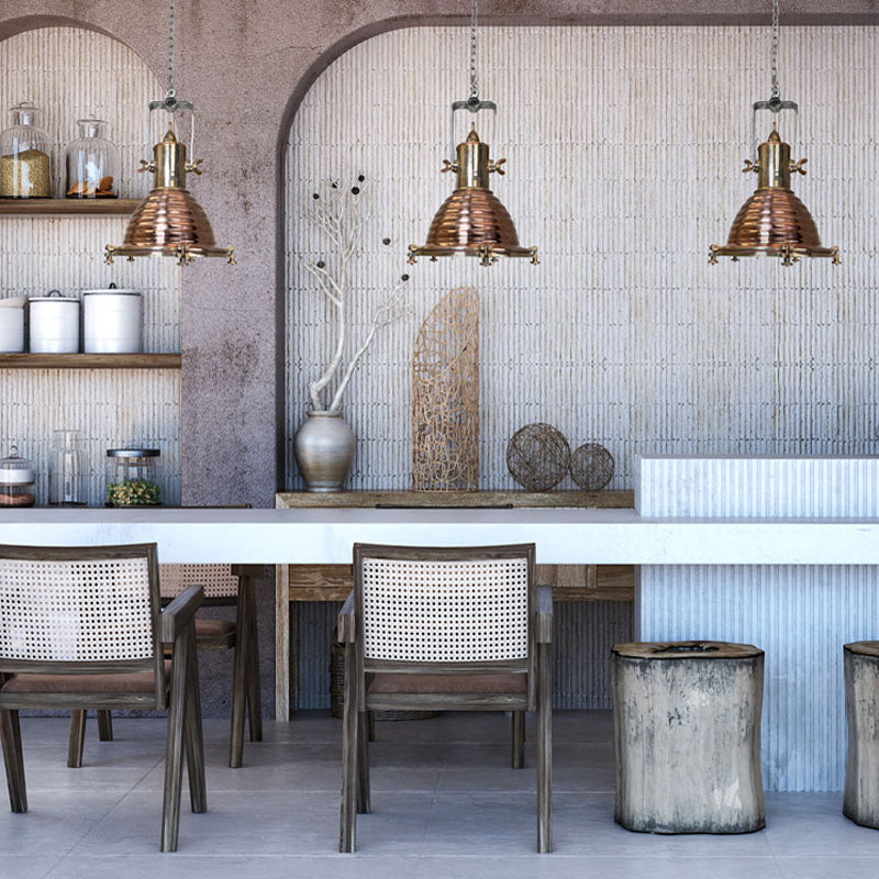 vintage industrial copper cargo ceiling pendants over a rustic beach kitchen island