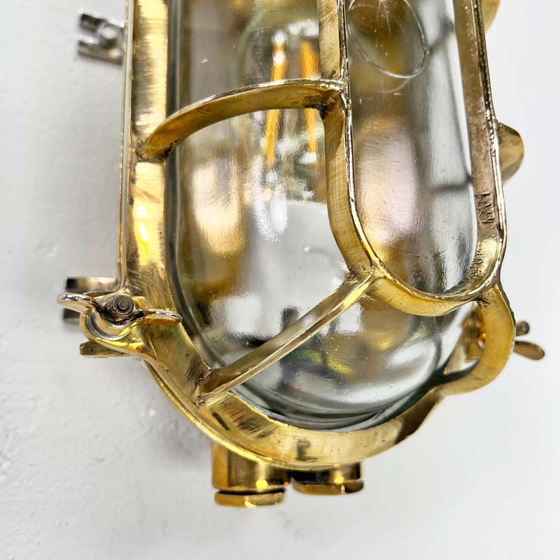 a vintage brass wall sconce which is an industrial wall light professionally restored for modern interiors. Fitted with LED light bulbs this cast brass wall light is ideal for creating industrial style interiors.