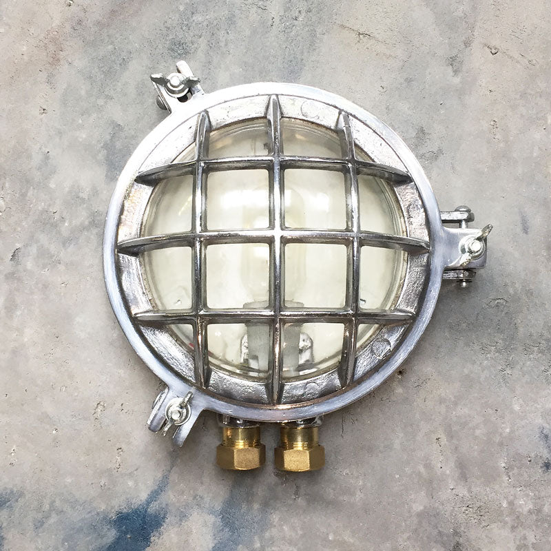 Shop our outdoor wall sconce made in aluminium with a robust metal cage. Vintage industrial lighting reclaimed and restored to modern standards.