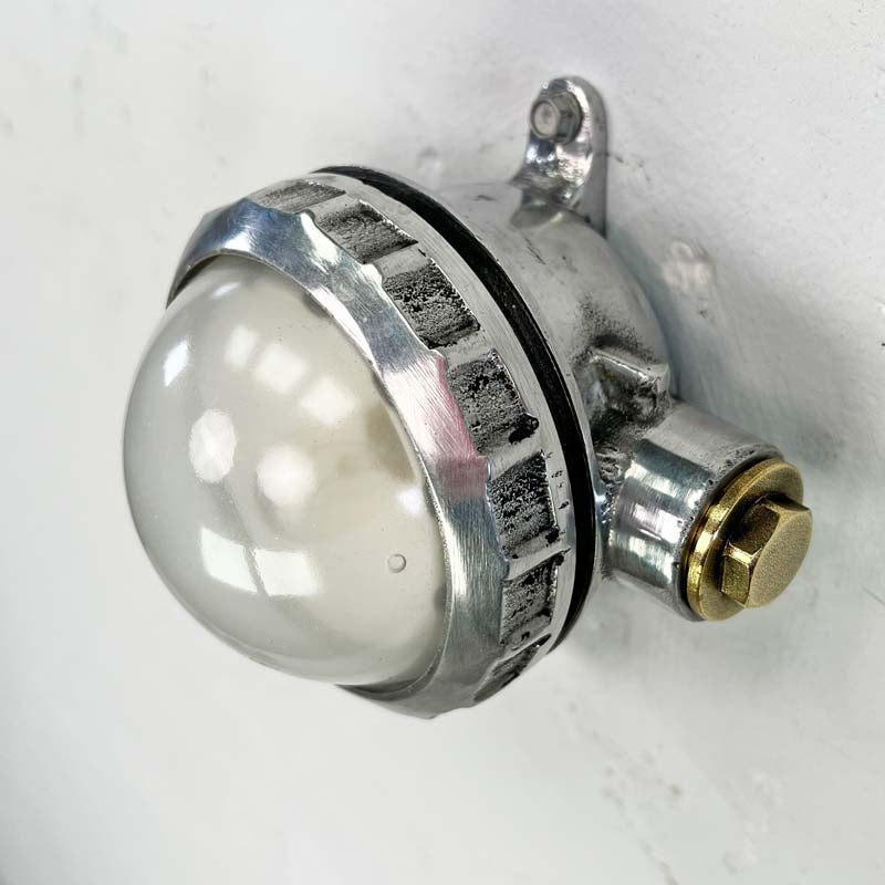 A small industrial spotlight which can be used for wall or ceiling lighting. A highly versatile small circular aluminium light with a frosted glass dome. Use with conduit piping where surface mounted electrical cables are required. Suitable for indoor use.&nbsp;