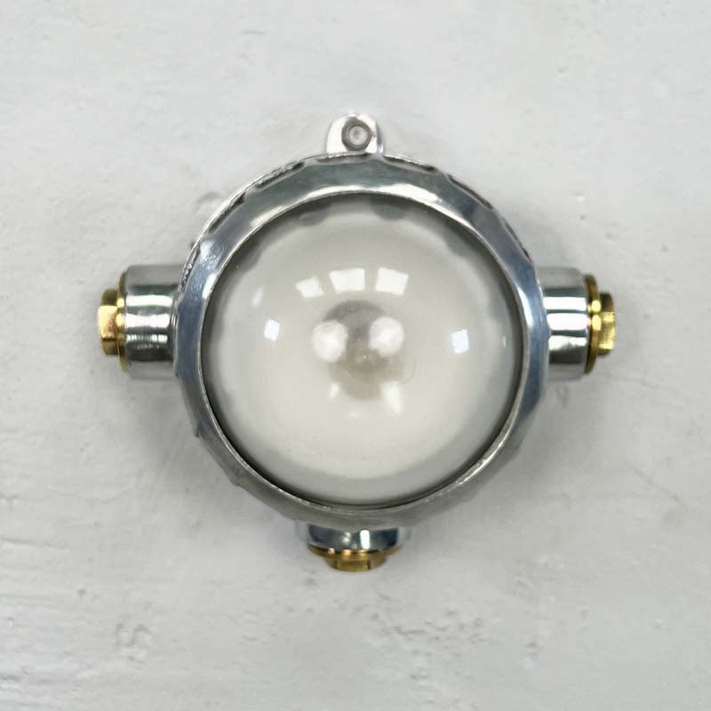 A small industrial spotlight which can be used for wall or ceiling lighting. A highly versatile small circular aluminium light with a frosted glass dome. Use with conduit piping where surface mounted electrical cables are required. Suitable for indoor use.&nbsp;