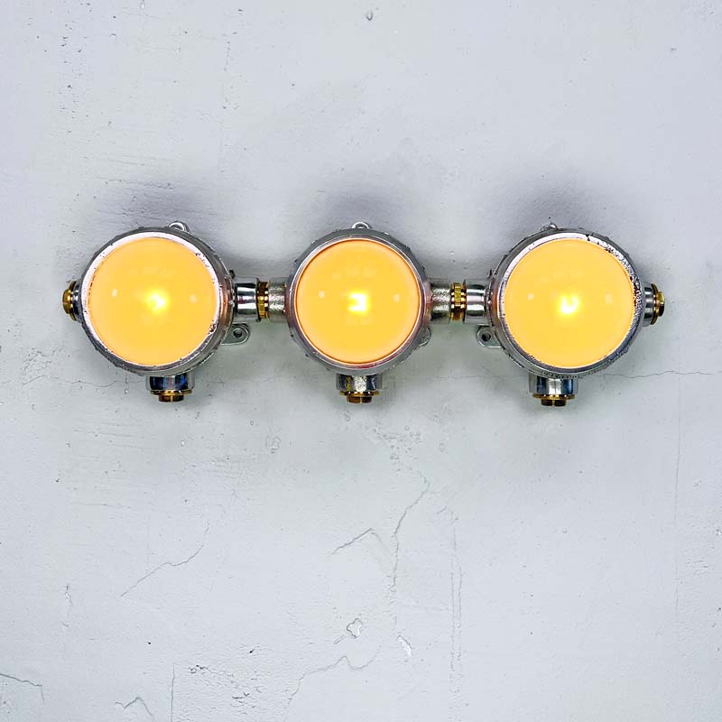 Shop unusual wall lights at Loomlight, restored vintage industrial lighting. This quirky trio of industrial spotlights has frosted glass and compatible with LED bulbs. 