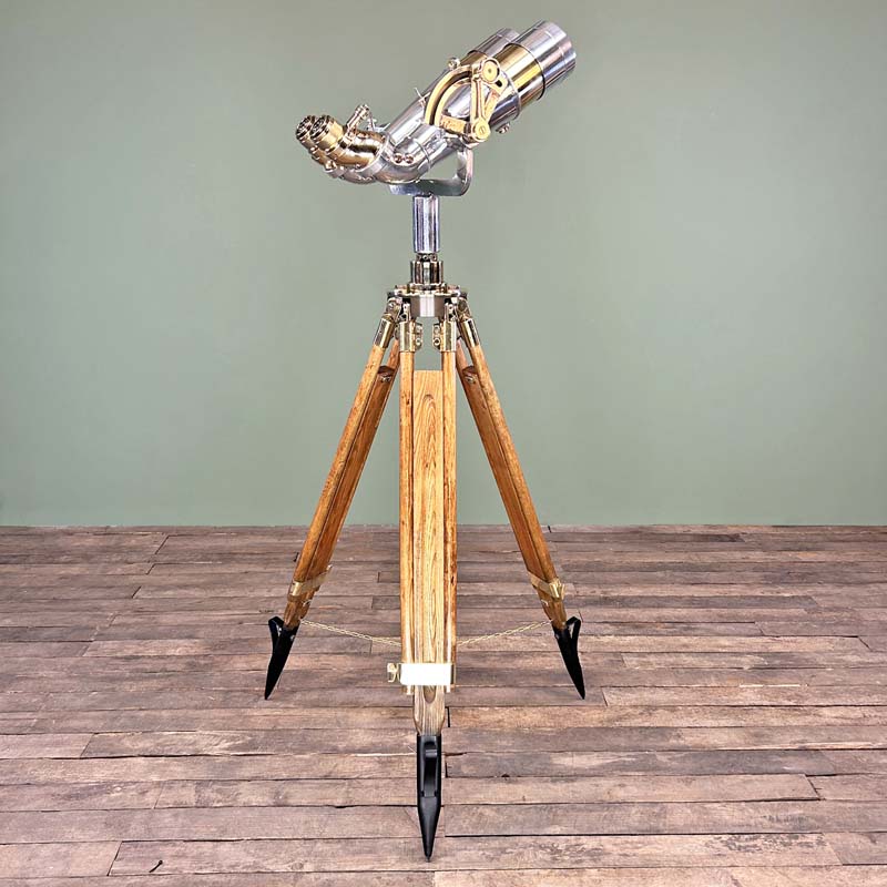 Shop for a refurbished set of antique binoculars paired with a German tripod with brass fittings and hard wood construction. Nikko 15x80  WWII military binoculars originally used for land, sea and air observation.