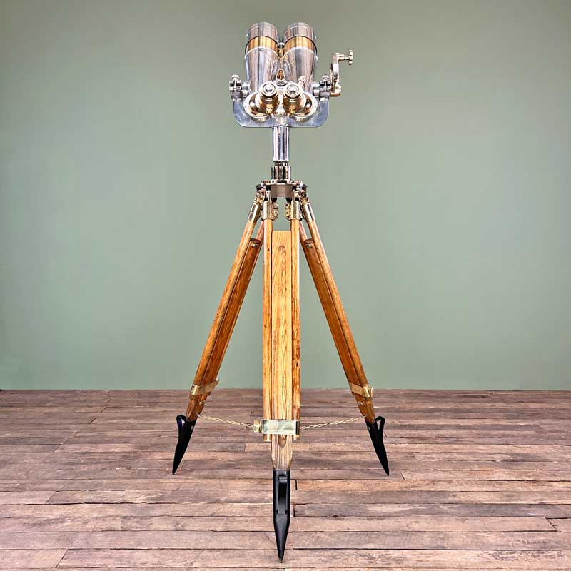 Shop for a refurbished set of antique binoculars paired with a German tripod with brass fittings and hard wood construction. Nikko 15x80 WWII military binoculars originally used for land, sea and air observation.