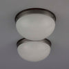 Two Hemispherical frosted opaline glass flush mount ceiling lights with bakelite mounting plate. 