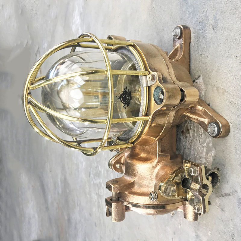 Shop for a bulkhead. Made in brass & bronze with a cage. These are vintage industrial lights restored for modern interiors. Flameproof and made by Kokosha a truly robust wall light. 