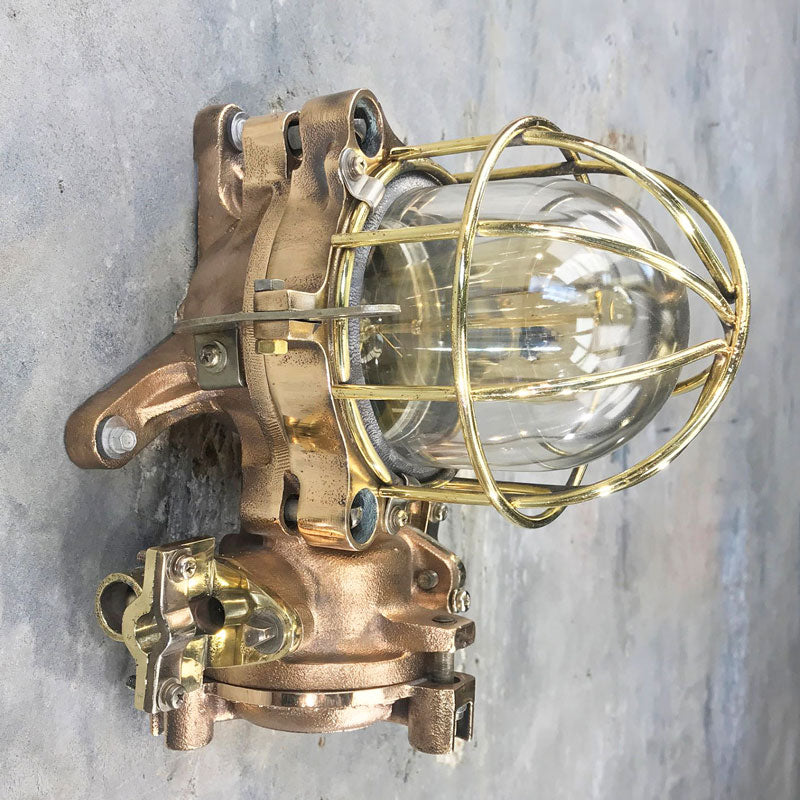 Shop for a bulkhead. Made in brass & bronze with a cage. These are vintage industrial lights restored for modern interiors. Flameproof and made by Kokosha a truly robust wall light. 