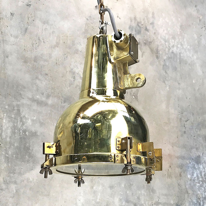 Vintage brass searchlight converted into an industrial style ceiling lamp