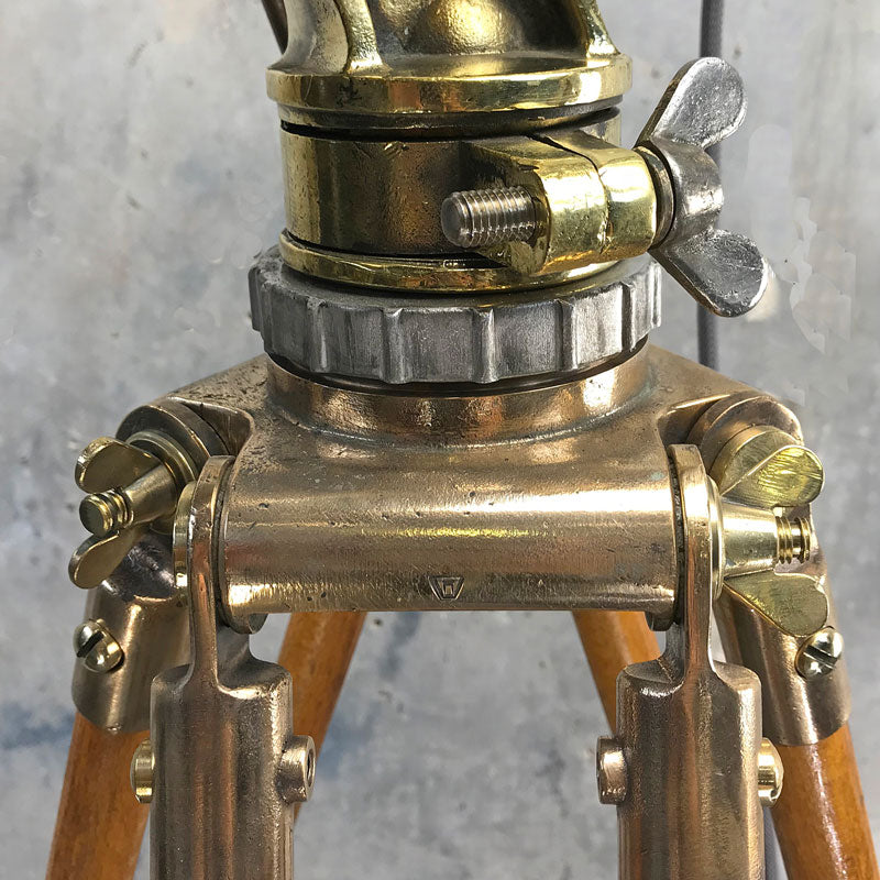 Shop our tall tripod lamp, it is a reclaimed industrial floor light comprising a vintage stainless steel searchlight on a wooden tripod. 