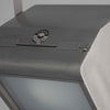Close-up of a vintage-style light fixture with 'Strand Electric' logo.