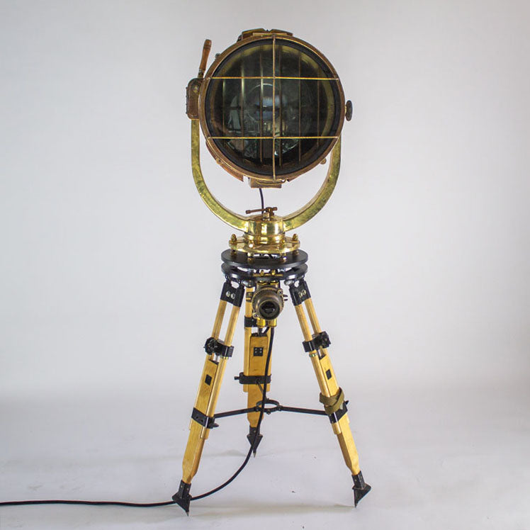 Daylight signal light by Shonan Kosakusho, reclaimed from military war ships. Paired with a military gyroscope to create a bespoke large tripod floor lamp