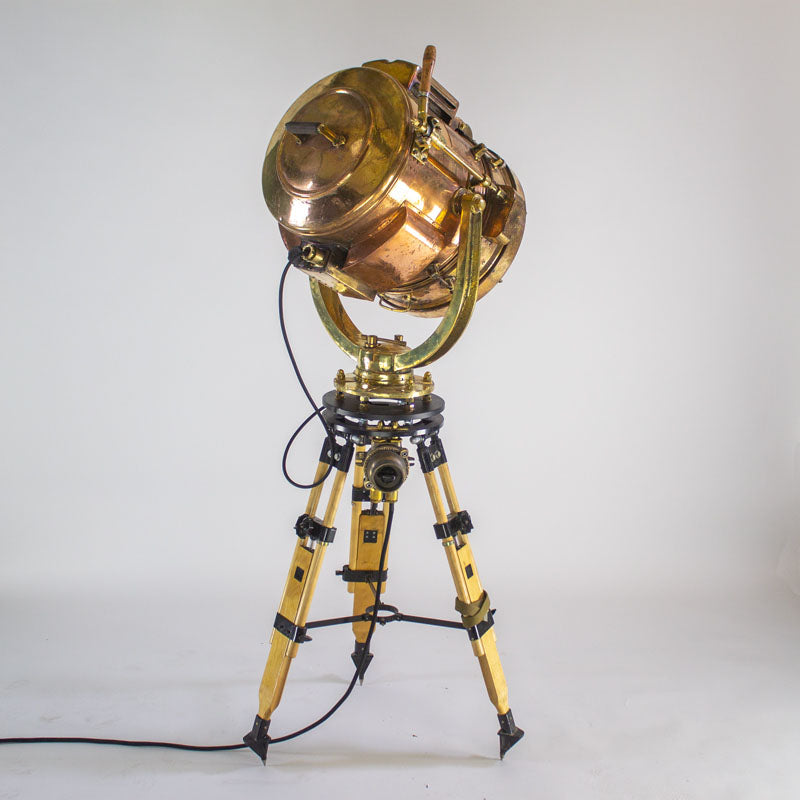 Daylight signal light by Shonan Kosakusho, reclaimed from military war ships. Paired with a military gyroscope to create a bespoke large tripod floor lamp