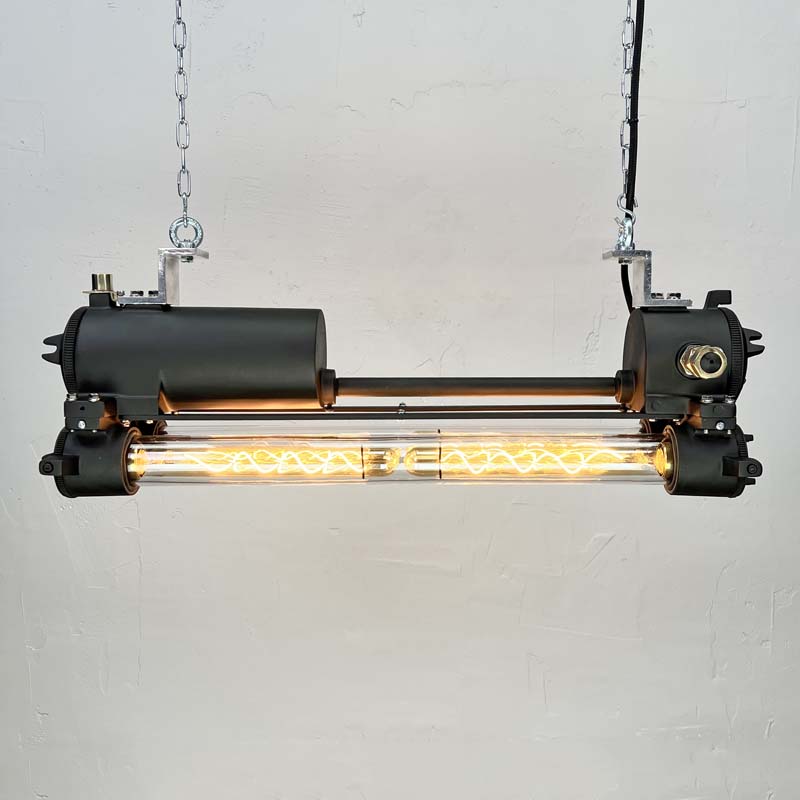 This vintage black pendant light is refurbished with dimmable Edison LED tubes and finished in matte black paint creating a beautifully restored original industrial strip light.